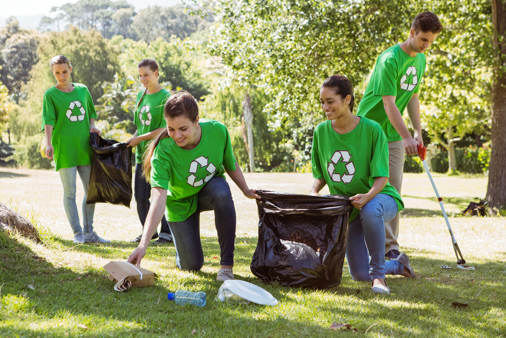 Environmental activists picking up trash on a sunny day